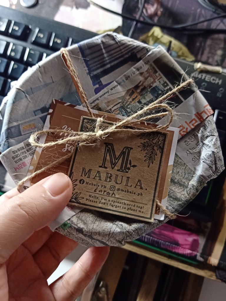 recycled packaging with newspaper, twine, and thank you note